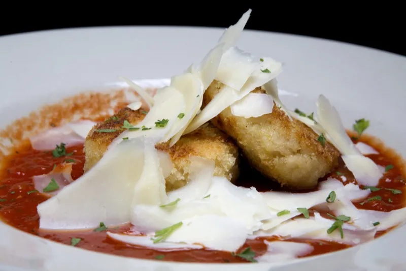 Risotto cakes in tomato sauce